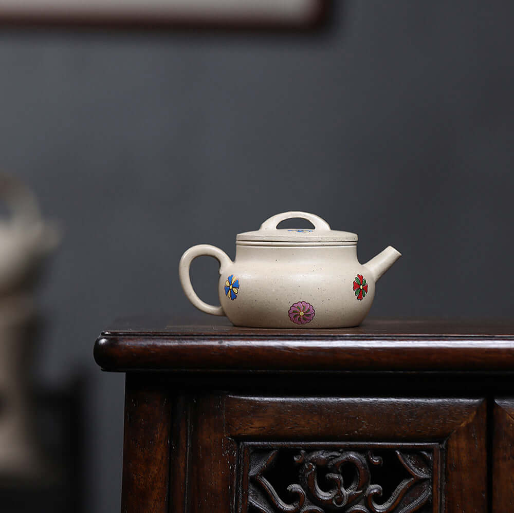 Handmade Yixing purple sand teapot with colorful floral accents, perfect for Kung Fu tea set, showcasing original craftsmanship.