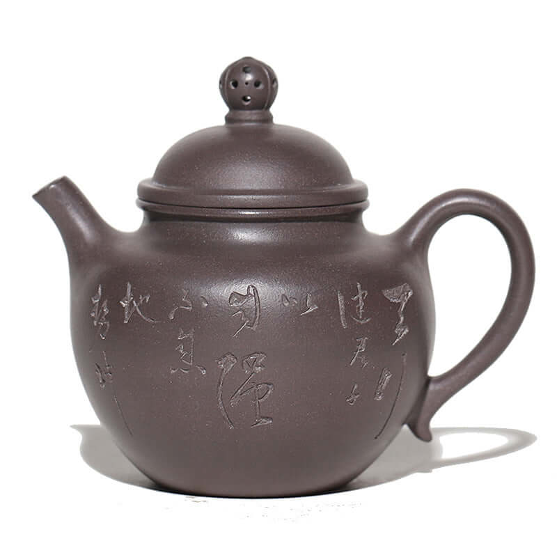 Handmade Yixing purple sand teapot with elegant design and intricate inscriptions, perfect for tea brewing.