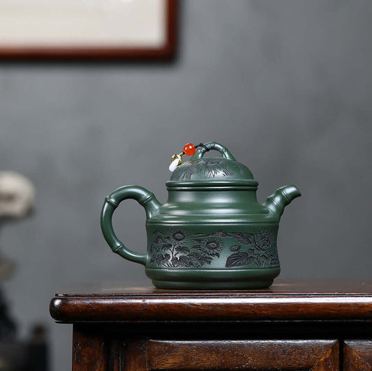 Handmade Yixing purple sand teapot with engraved flowers, bamboo tripod design, ideal for Kung Fu tea set, home use.