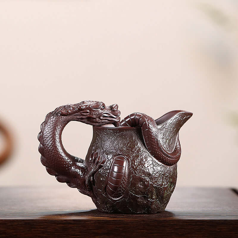 Handmade Yixing purple sand fair cup with dragon design, showcasing exquisite craftsmanship and traditional Chinese culture.