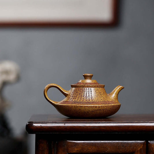 Handmade Yixing purple sand teapot on wooden table, showcasing unique craftsmanship and traditional design for kung fu tea.