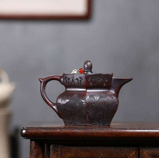 Handmade Yixing purple sand teapot with intricate design, ideal for Kung Fu tea ceremonies, crafted by skilled artisans.