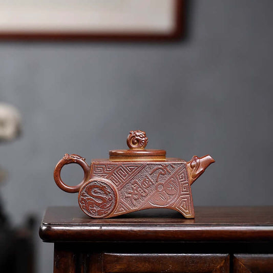 Handmade Yixing purple sand teapot featuring intricate design, crafted from raw ore, ideal for household tea set.