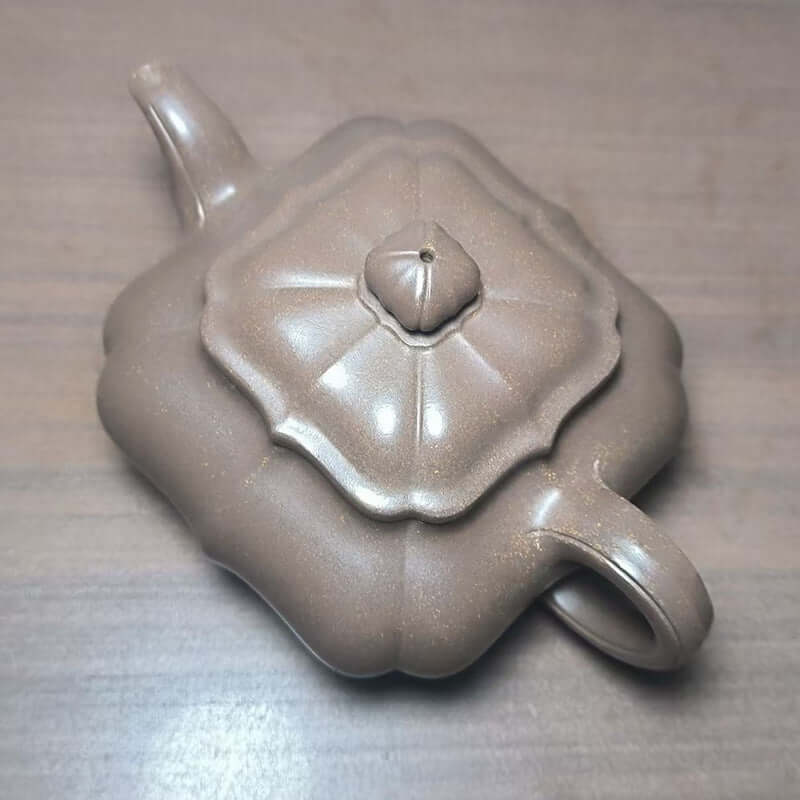 Handmade Yixing purple sand teapot, original design, ribbed body, crafted by Yixing craftsmen, perfect for tea brewing.