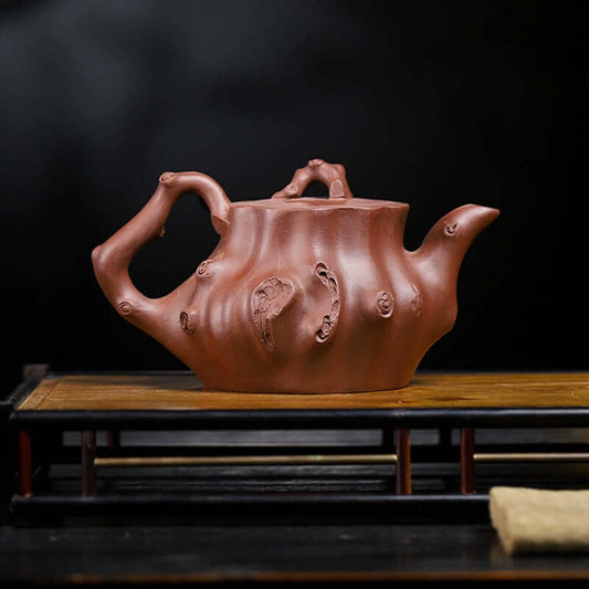 Handmade Yixing purple sand teapot with tree stump design, crafted from original purple sand, perfect for home tea sets.