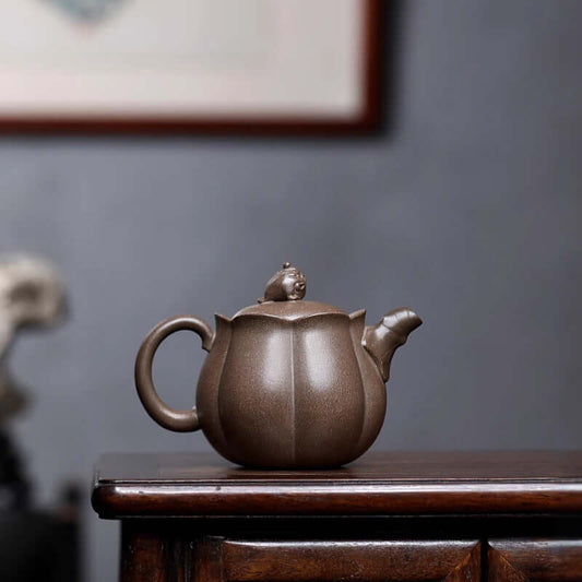 Handmade Yixing purple sand teapot featuring a golden toad motif, perfect for a home kung fu tea set.