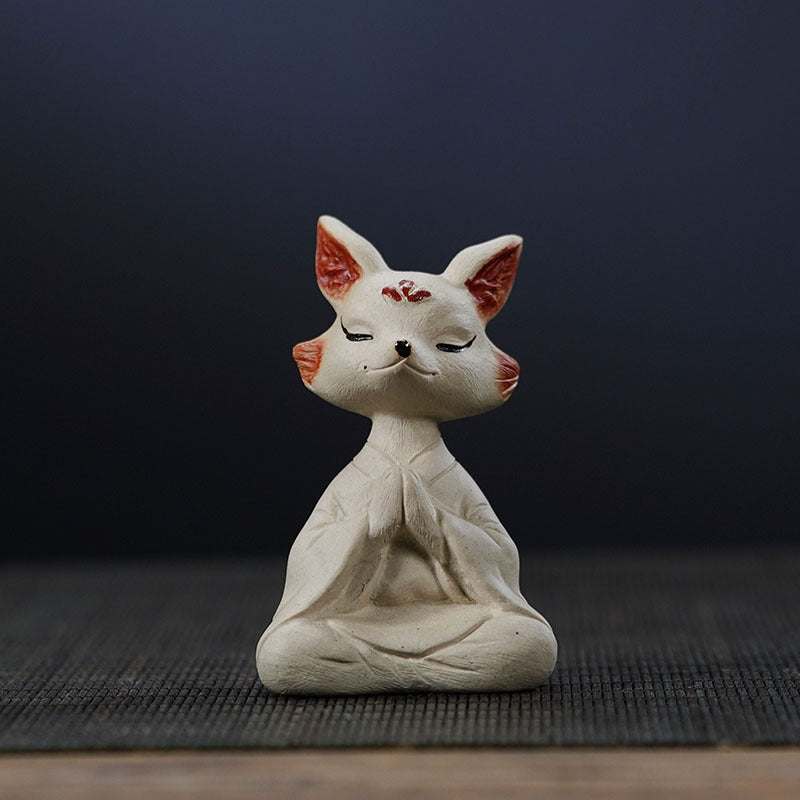 Handmade purple clay fox tea pet ornament, crafted from Yixing purple sand, perfect for zen tea table decor.