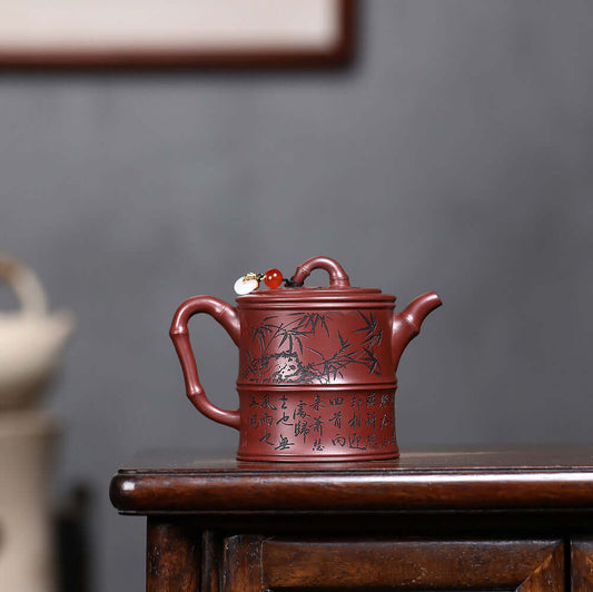 Handmade Yixing purple sand teapot with bamboo design, perfect for Kung Fu tea set, showcasing artisan craftsmanship.