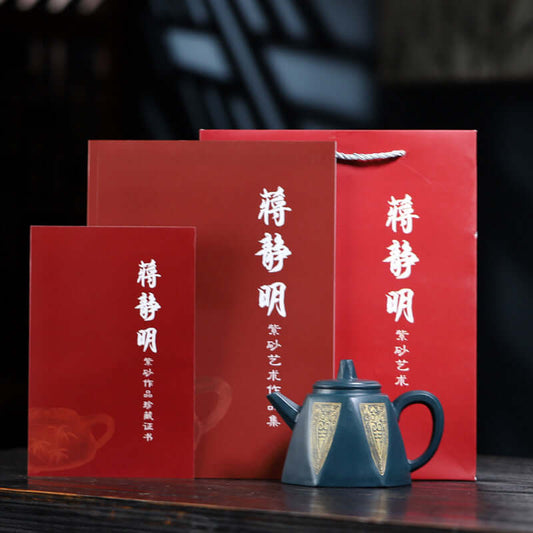 Handmade Yixing purple sand teapot with red packaging and certificates, showcasing exquisite craftsmanship.