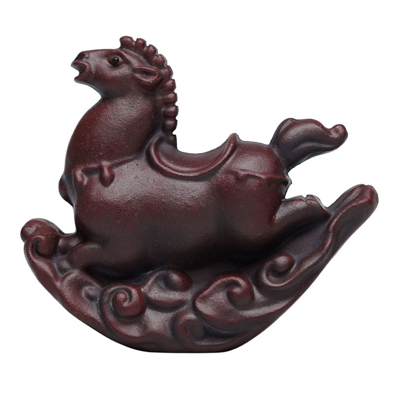 Handmade Yixing purple sand tea pet ornament, creative Trojan horse design for tea play and home decoration.