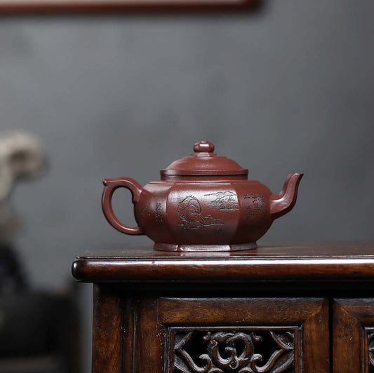 Handmade Yixing purple sand teapot with engraved design, perfect for a traditional kung fu tea set.