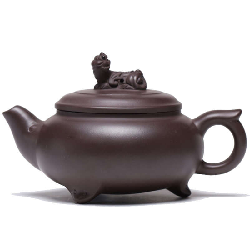 Handmade Yixing purple sand teapot with tiger lid, showcasing traditional Chinese craftsmanship and unique design.