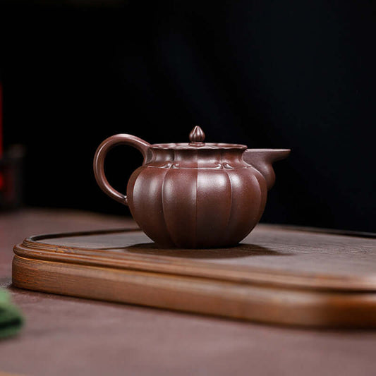Handmade Yixing purple sand teapot featuring a traditional design, crafted from original purple sand for home use.