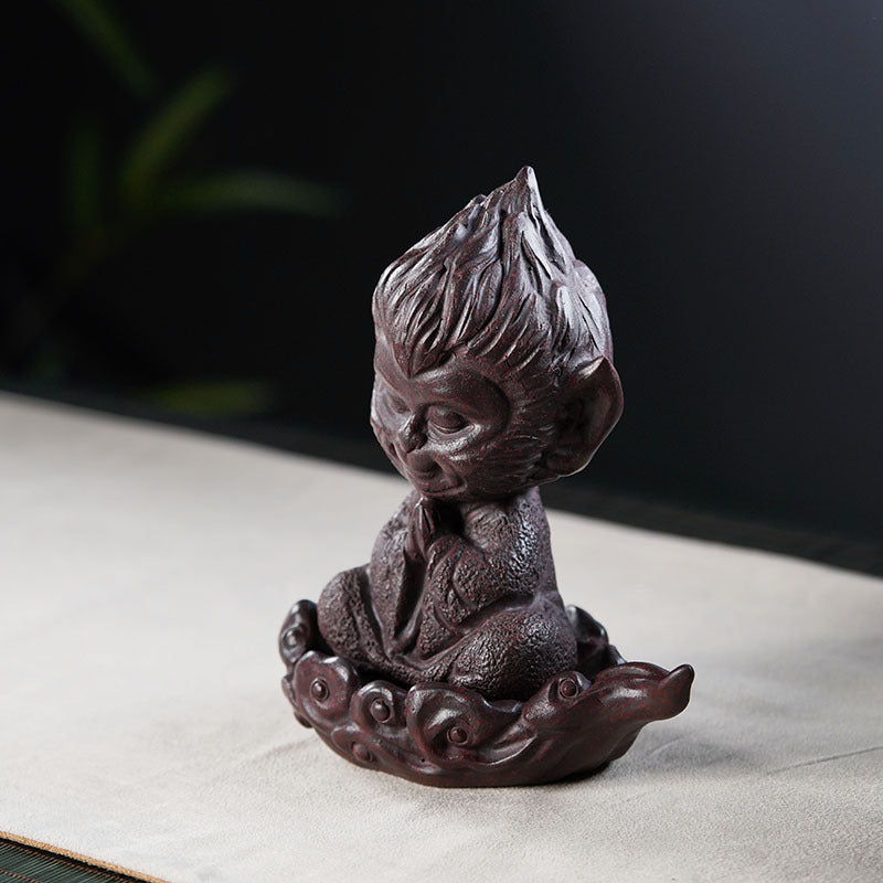 Handmade Chinese-style Sun Wukong ornament in Yixing purple sand, perfect for desktop tea table decor.