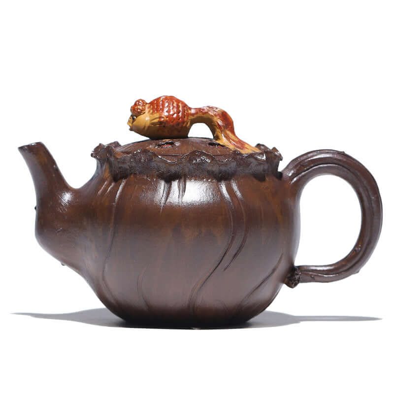 Handmade Yixing purple sand teapot featuring a unique fish design on the lid, crafted from original purple clay.