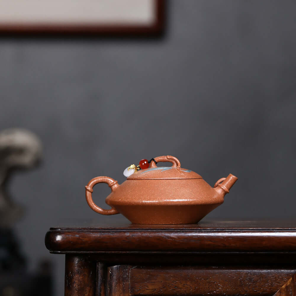 Handmade Yixing purple sand teapot with decorative beads, ideal for Kung Fu tea set and dropshipping.