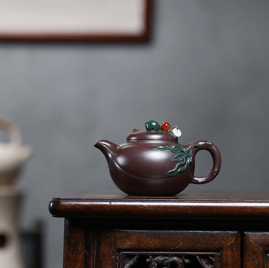 Handmade Yixing purple sand teapot, original mineral clay, peach shape, ideal for Kung Fu tea, artisan crafted, elegant design.