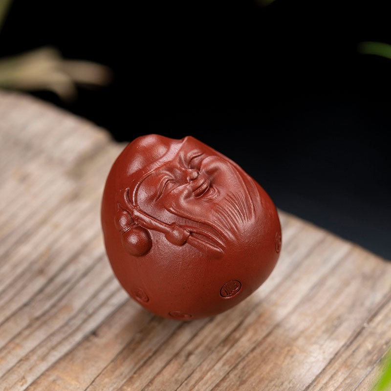 Handmade Yixing purple sand tea pet ornament, a happy egg design, perfect for tea lovers and gift giving.