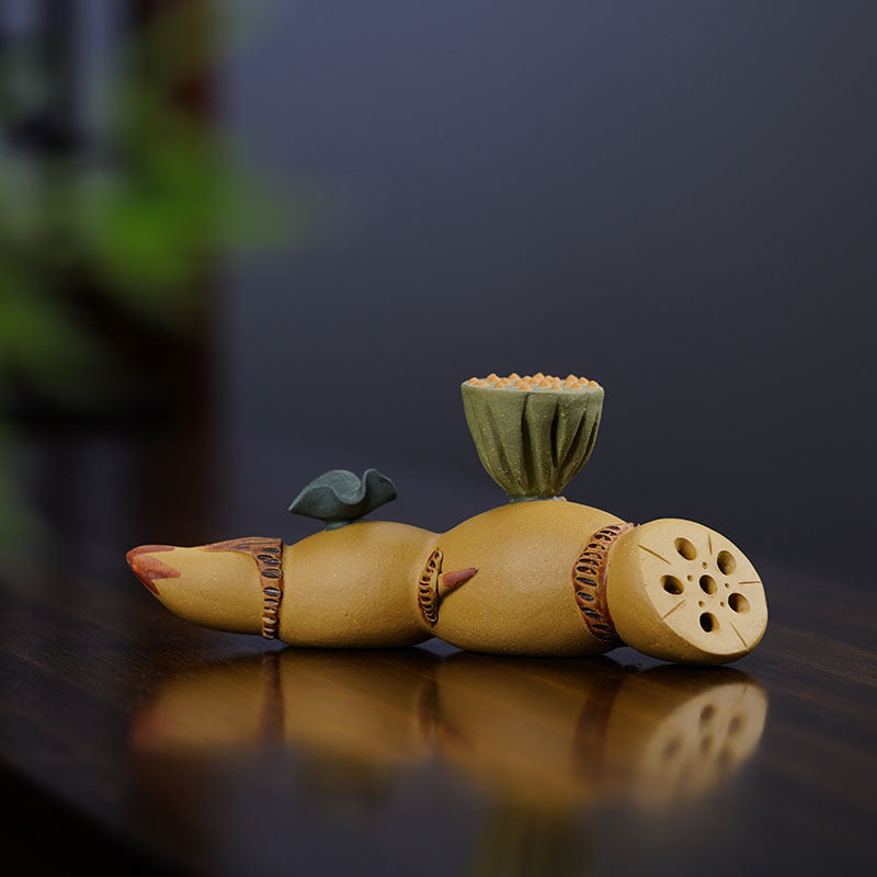 Handmade Yixing purple sand lotus root tea pet decoration, showcasing intricate craftsmanship in original purple sand material.