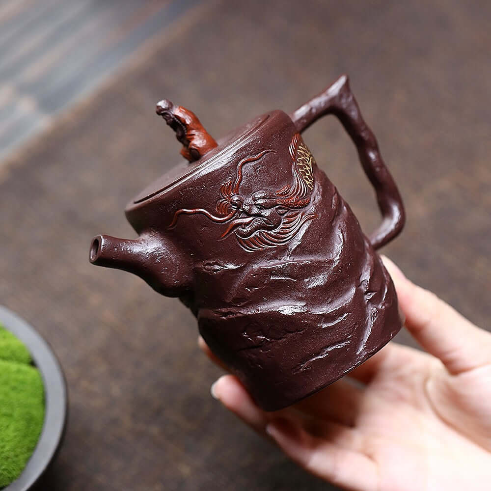 Handmade Yixing purple sand teapot with dragon design, perfect for home Kung Fu tea set, showcasing unique craftsmanship.