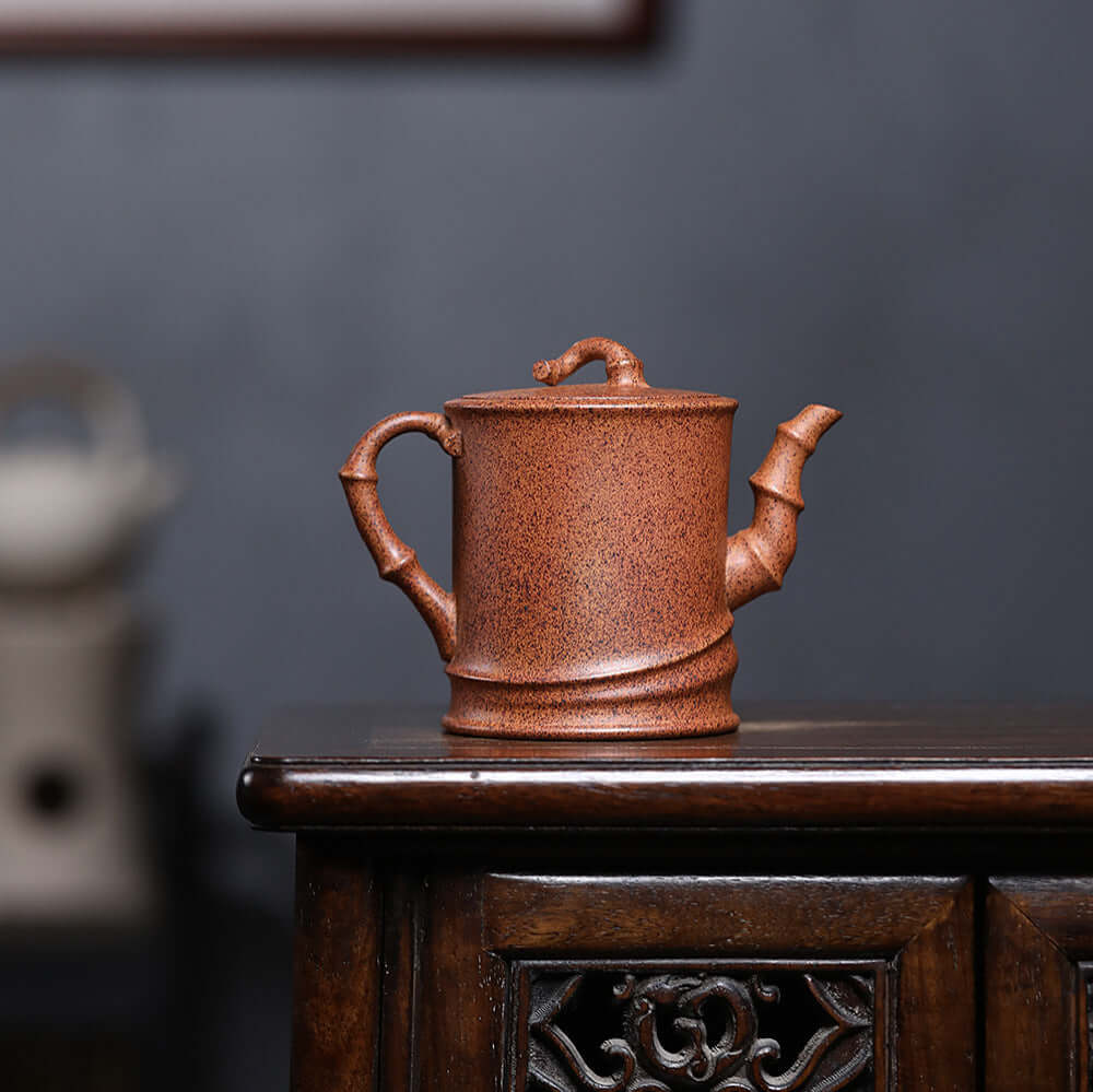 Handmade Yixing purple sand teapot with unique bamboo design, ideal for household Kung Fu tea sets.