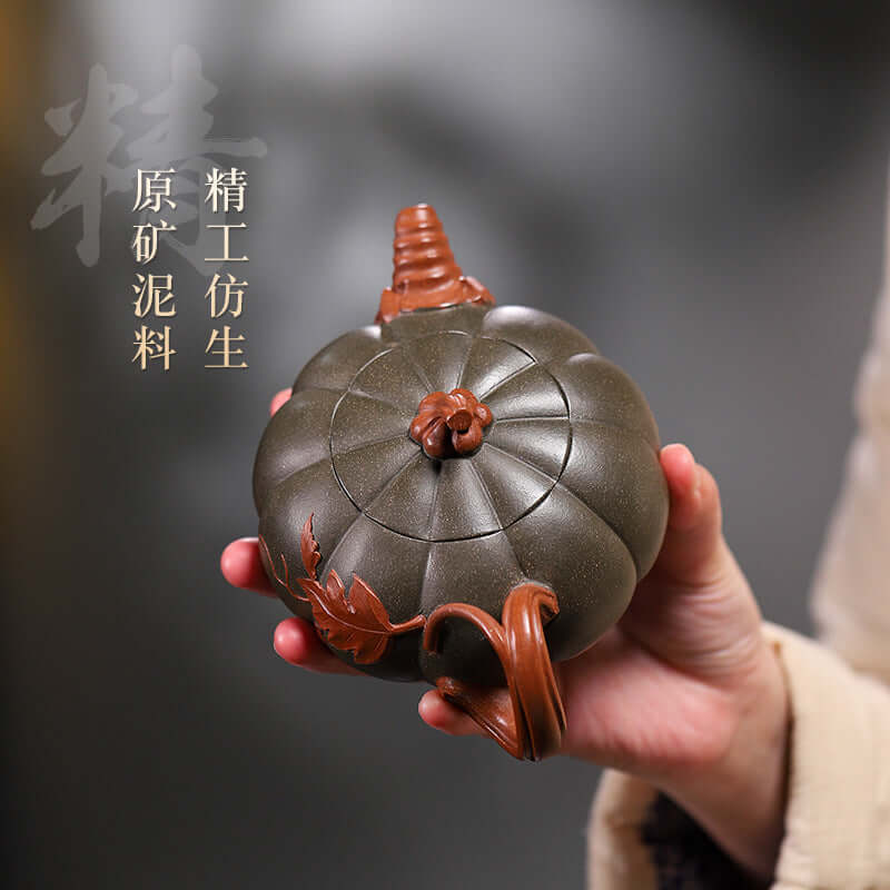 Handmade Yixing purple sand teapot shaped like a pumpkin, showcasing intricate detailing and craftsmanship.