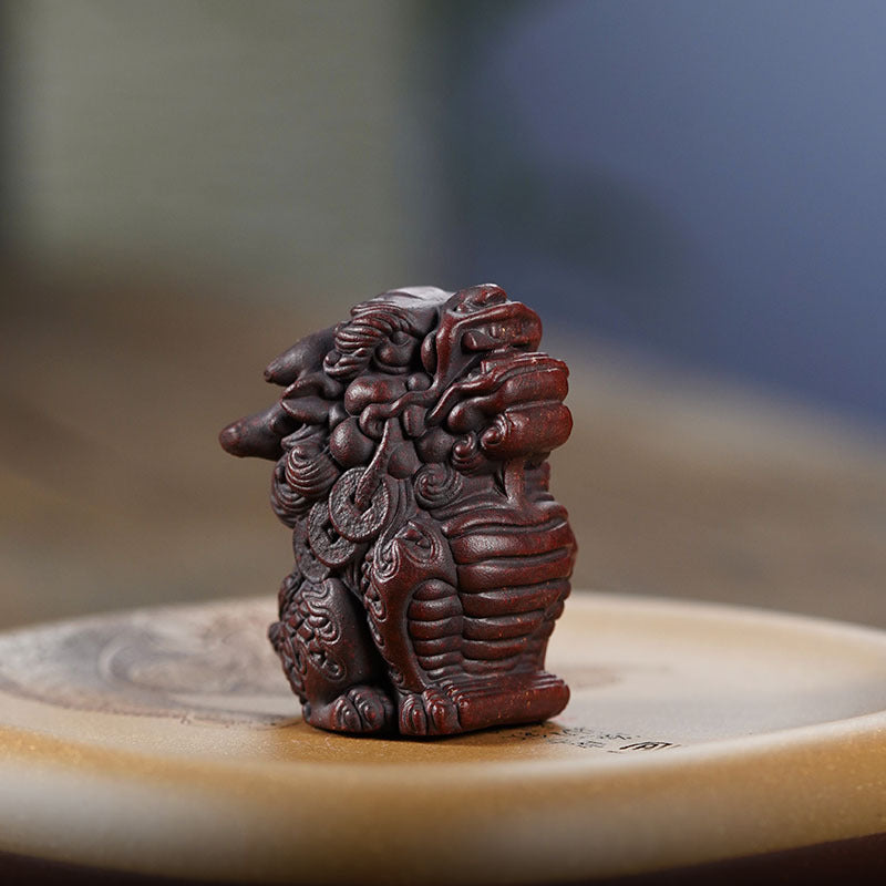 Handmade Yixing purple sand Kirin tea pet, crafted by Yixing artisans, perfect for tea ceremonies and home decoration.