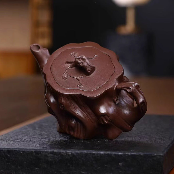 Handmade Yixing purple sand teapot with detailed lid design, perfect for tea enthusiasts and collectors.