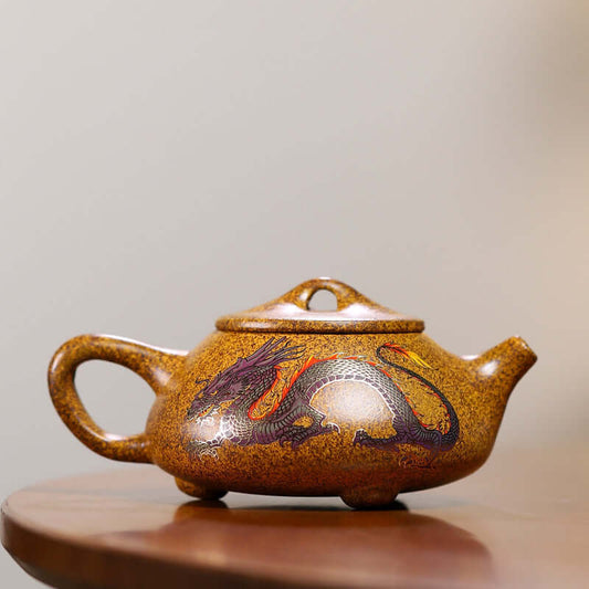 Handmade Yixing purple sand teapot featuring a vibrant dragon design with color-changing properties.