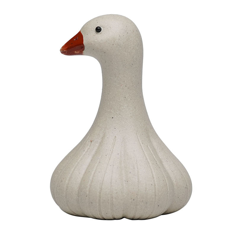 Handmade Yixing purple sand tea pet in the shape of a cute duck, perfect accessory for tea ceremonies and decoration.