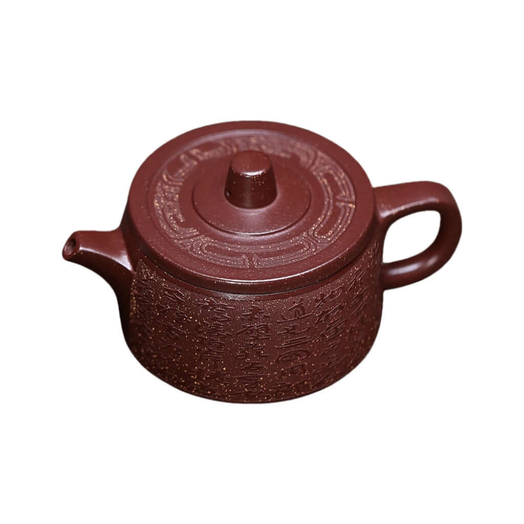 Handmade Yixing purple sand teapot featuring intricate designs, perfect for home kung fu tea sets.