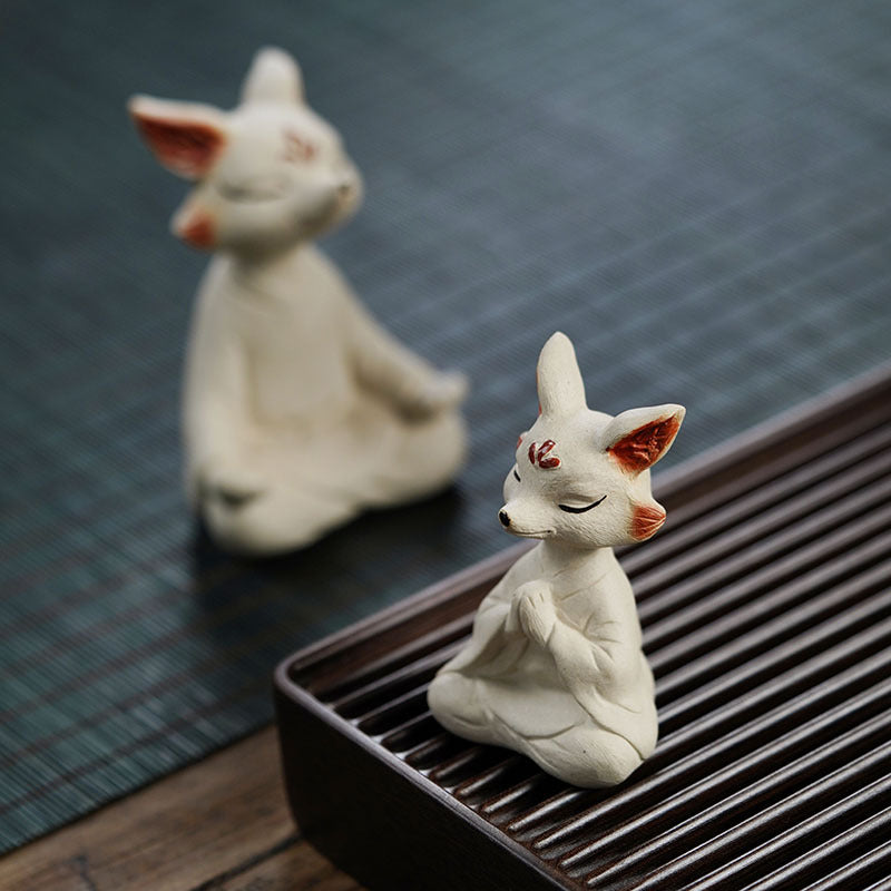 Handmade purple clay tea pet fox sculpture for tea table decor, artisan Yixing purple sand craftsmanship.