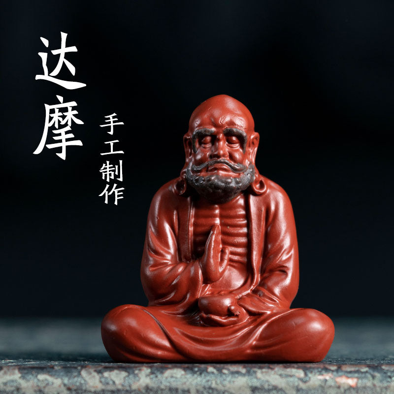 Handmade Yixing purple sand monk sculpture, perfect for tea ceremonies and collectors of unique tea accessories.