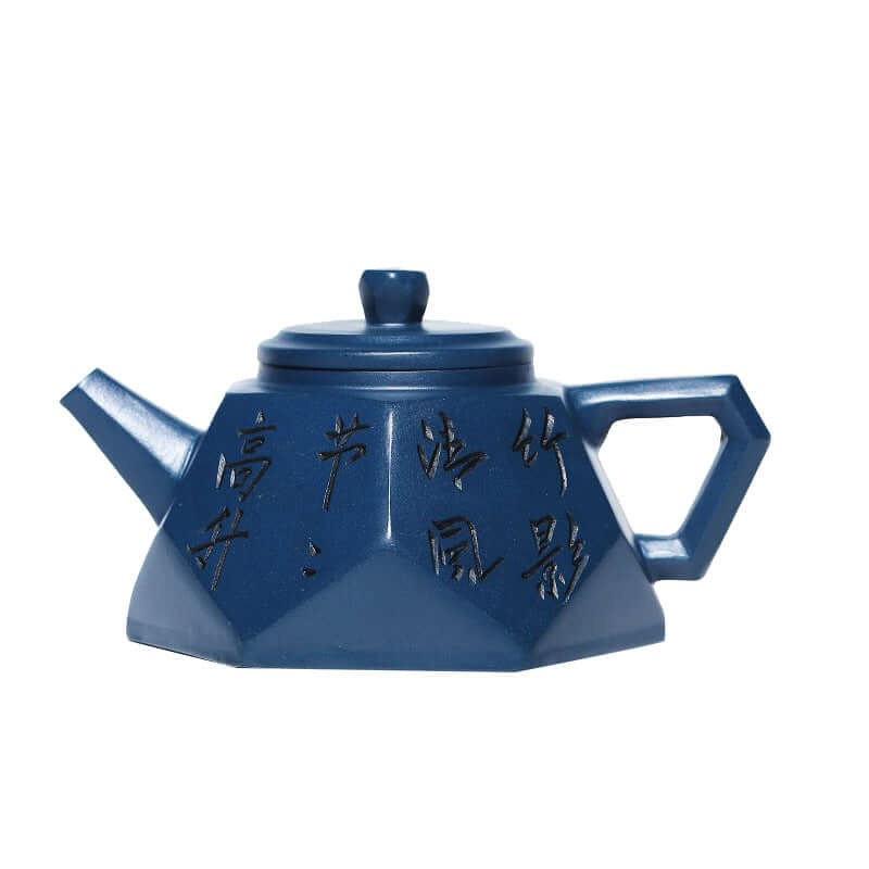 Handmade Yixing purple sand teapot in blue, featuring unique diamond shape and engraved calligraphy.