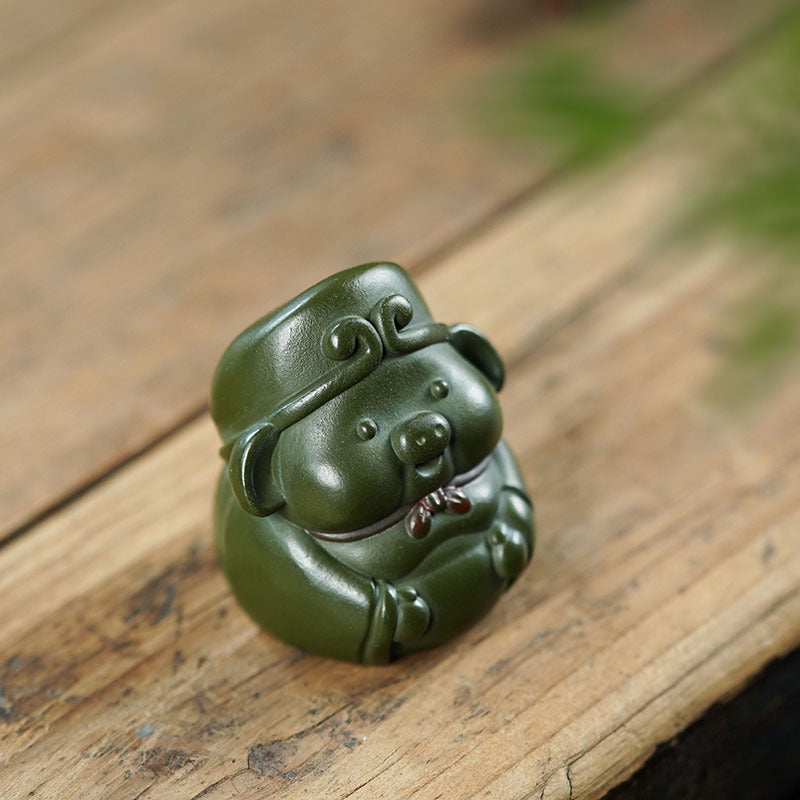 Handmade Yixing purple sand pig sculpture, green mud tea pet ornament, perfect for tea table decor.