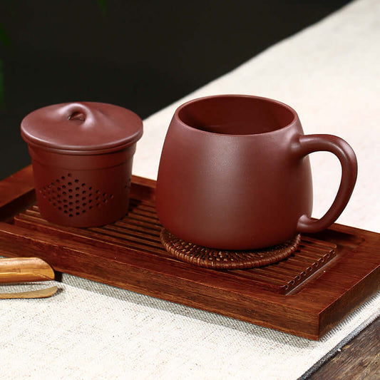 Handmade Yixing purple sand tea set including cup and lid, perfect for tea ceremonies and as a business gift.
