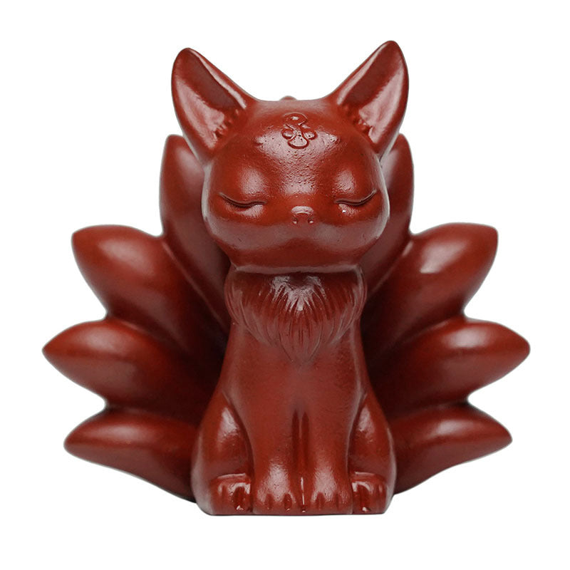 Handmade Yixing purple sand sculpture of a nine-tailed fox, perfect for tea table decoration and creative tea toys.