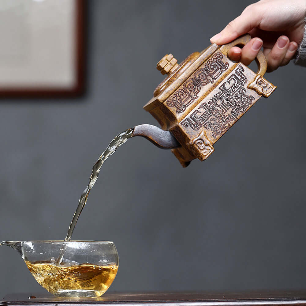 Handmade Yixing purple sand teapot pouring tea, showcasing craftsmanship and traditional kung fu tea culture.