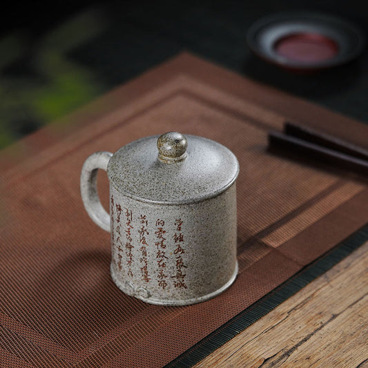 Handmade Yixing purple sand mug with traditional Chinese text, perfect for tea lovers and home use.