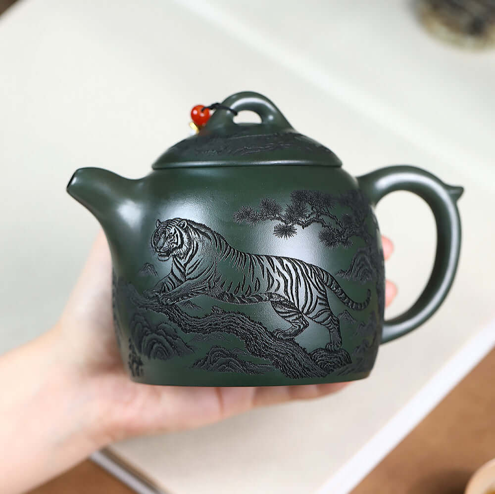 Handmade Yixing purple sand teapot featuring a tiger design, showcasing original craftsmanship with large capacity.