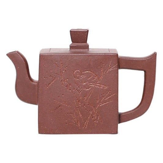Handmade Yixing purple sand teapot with bird engraving, square design, perfect for tea enthusiasts.