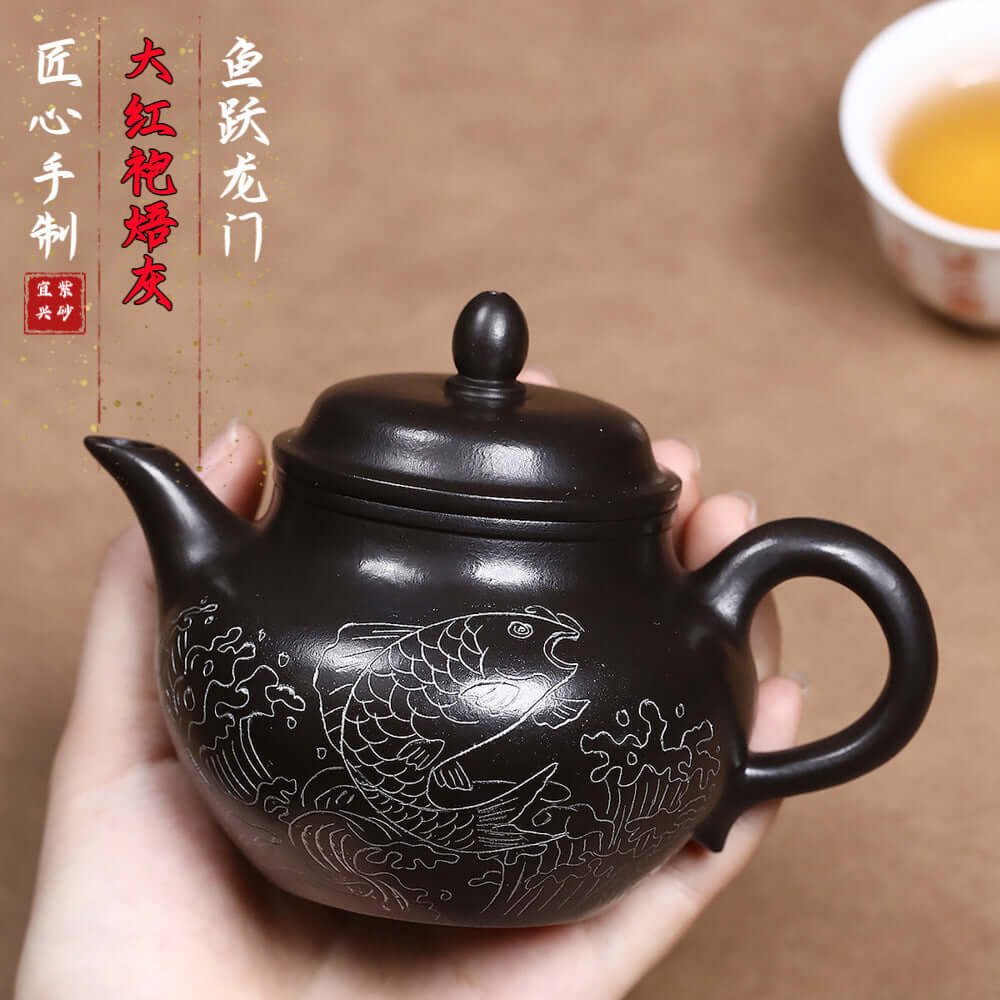 Handmade Yixing purple sand teapot featuring a fish design, ideal for Kung Fu tea sets and drop shipping.
