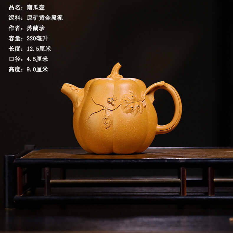Handmade Yixing purple sand teapot in pumpkin shape, showcasing unique craftsmanship and original purple sand design.