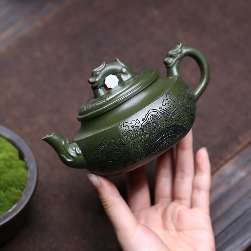 Handmade Yixing purple sand teapot in green, featuring intricate designs, perfect for home kung fu tea set.