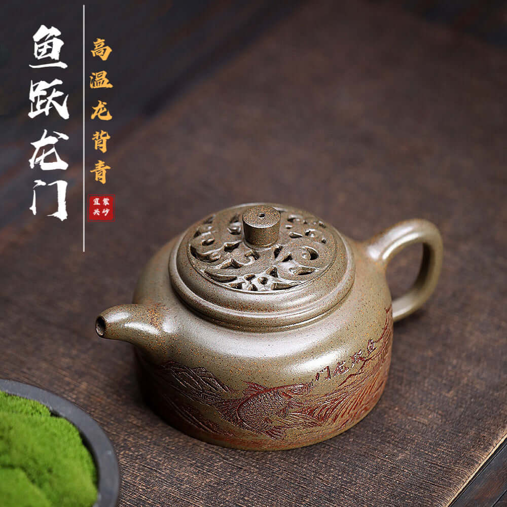 Handmade Yixing purple sand teapot featuring intricate dragon design, ideal for home tea set and tea lovers.