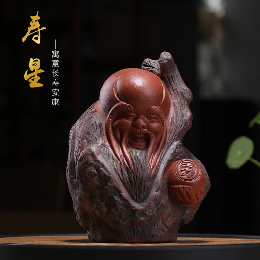 Handmade Yixing purple sand tea pet sculpture of Shouxing, the Chinese god of longevity, perfect for tea tray decoration.