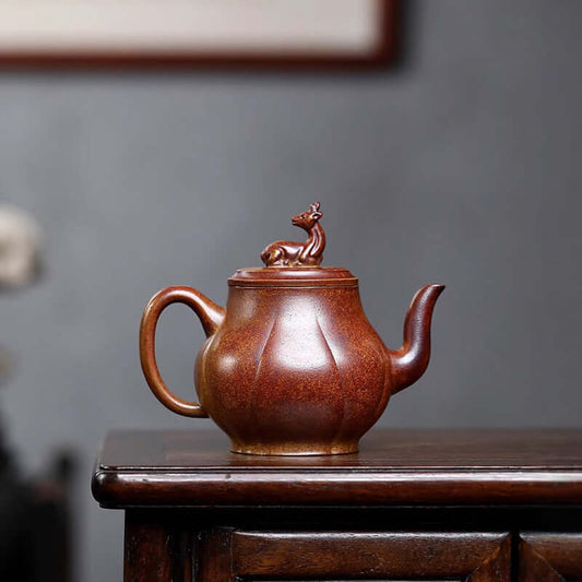 Handmade Yixing purple sand teapot with deer lid, crafted using ancient methods, perfect for home tea sets.