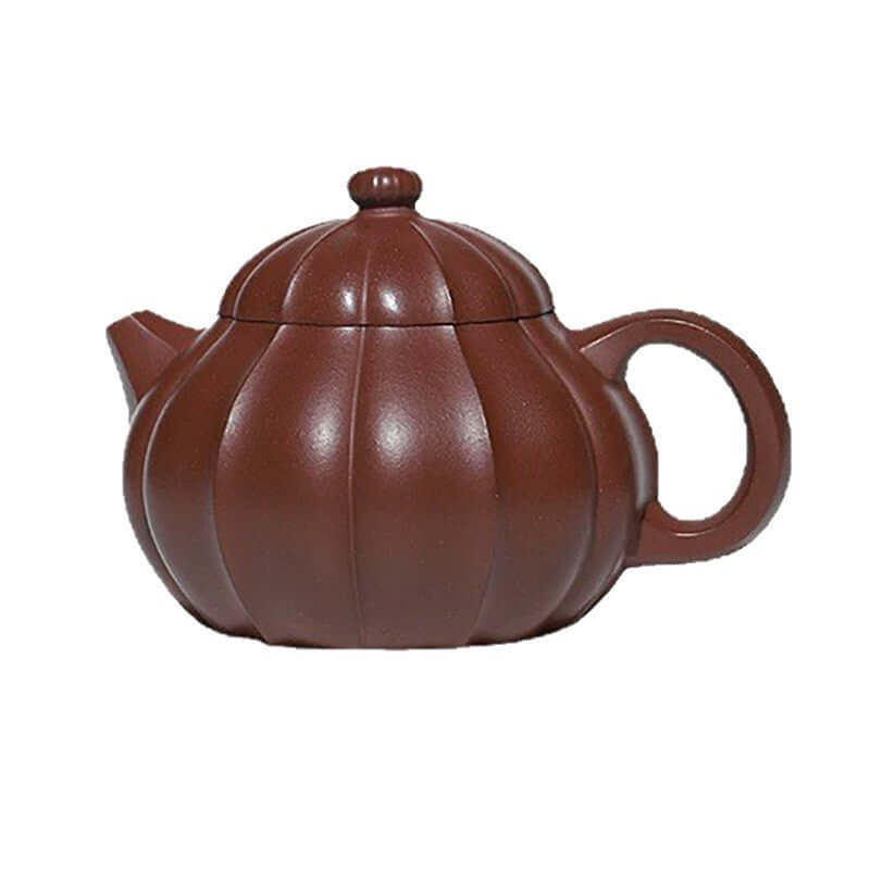 Handmade Yixing purple sand teapot with a pumpkin design, crafted by skilled artisans for home use.
