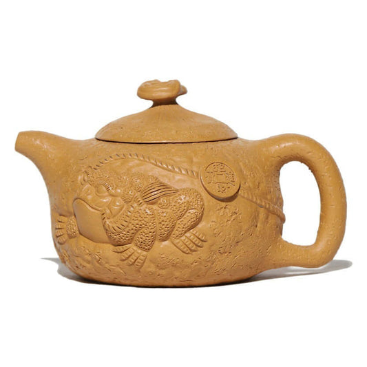 Handmade Yixing purple sand teapot featuring intricate frog design, perfect for tea enthusiasts and collectors.