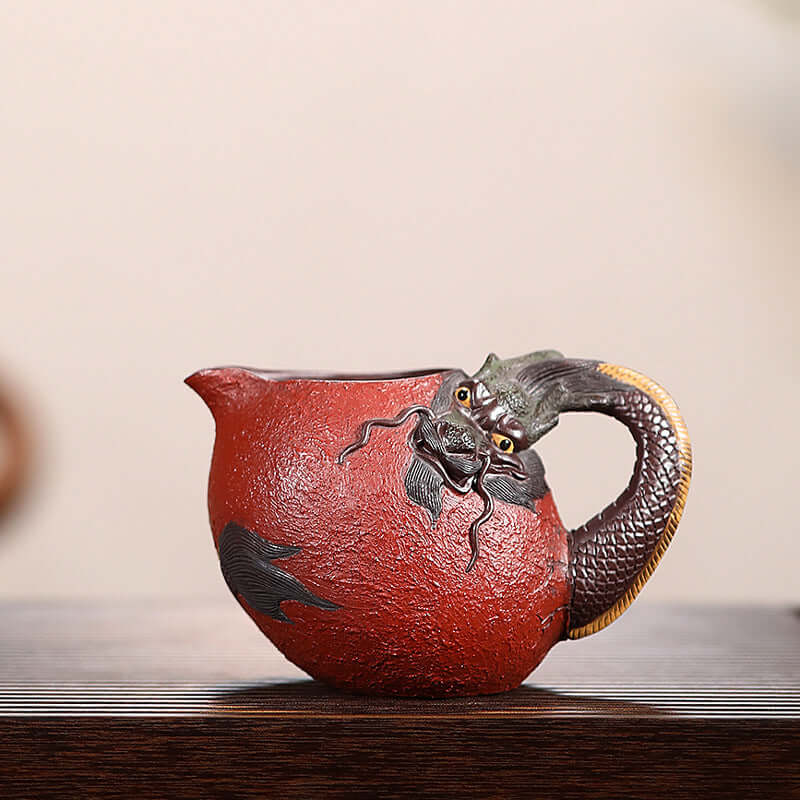 Handmade Yixing purple sand fair cup featuring a dragon design, showcasing traditional craftsmanship and elegant artistry.